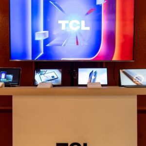 Showroom display featuring TCL electronics including TVs and tablets with vibrant screens.